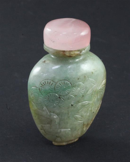 A Chinese pale green and russet jadeite snuff bottle, 1880-1930, 5.9cm